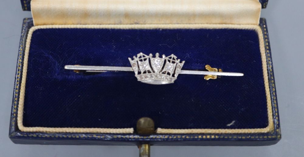 A 14ct, plat and diamond set coronet sweethearts bar brooch, 49mm, gross 3.7 grams, in Gieves box.